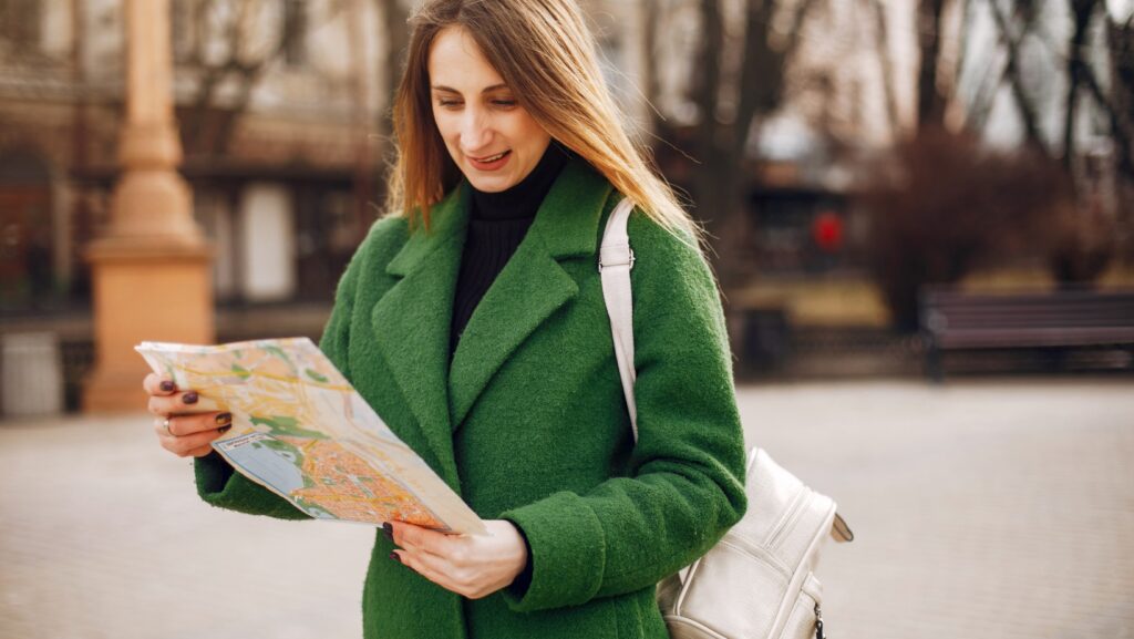 A woman holding a map, symbolizing personal navigation and control over mental health treatment paths