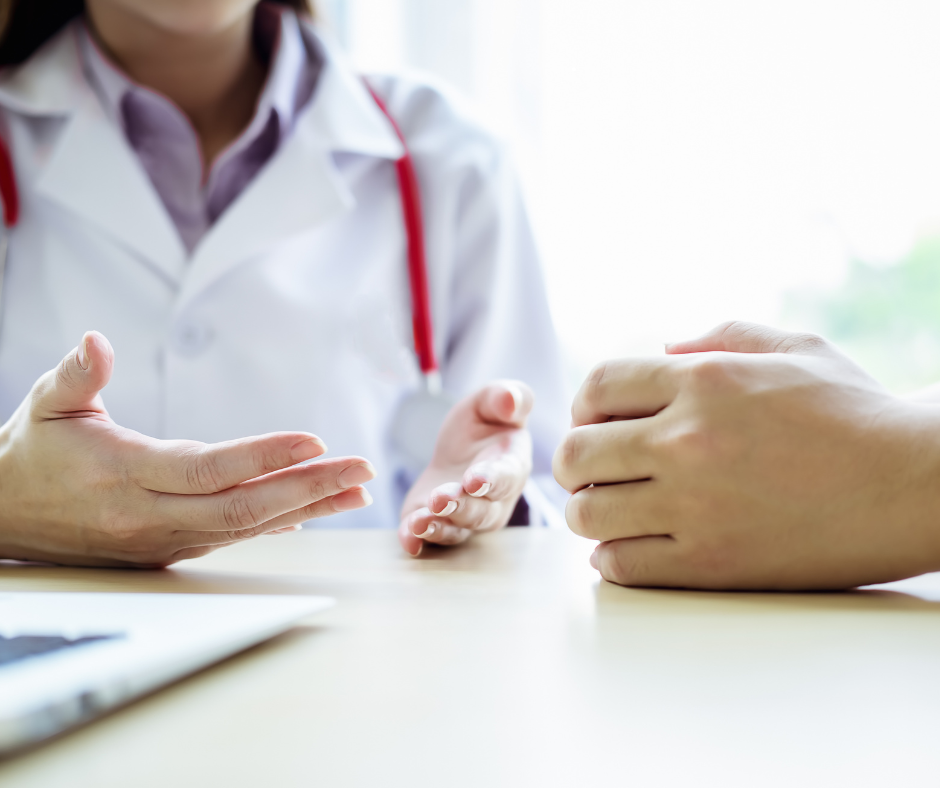 A healthcare provider discussing a mental health diagnosis with a patient, their hands gesturing compassionately during a consultation, symbolizing understanding and support in mental health care.